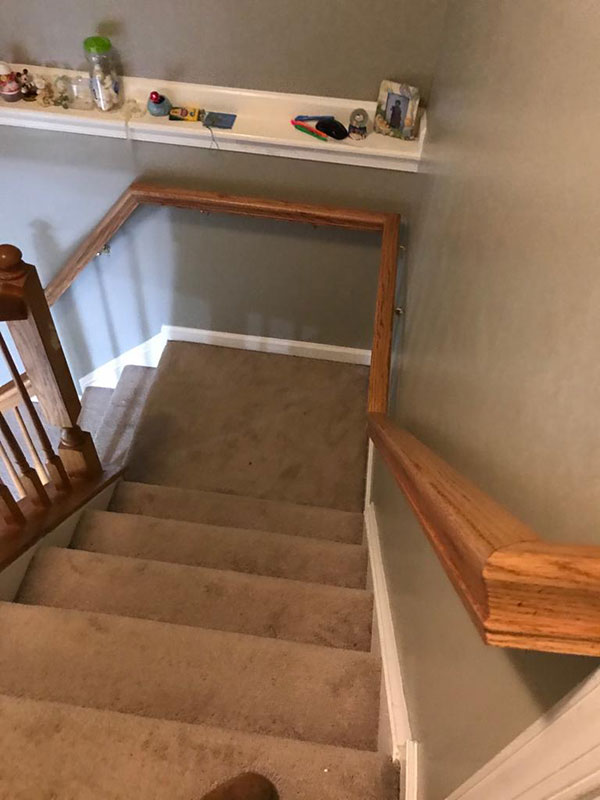 Bannister wood railing installed in Rockville, MD. It is coonected continously on the left side of staircase ascending.